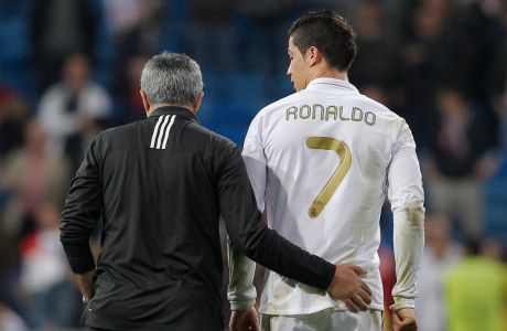 Real Madrid's coach Jose Mourinho from Portugal embraces Cristiano Ronaldo from Portugal after a Champions League round of 16, second leg soccer match against CSKA Moscow's at the Santiago Bernabeu Stadium, in Madrid, Wednesday, March 14, 2012. (AP Photo/Daniel Ochoa de Olza)