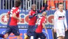 Cagliari's forward Victor Ibarbo (C) celebates with teammates after scoring against AC Milan during their Serie A football match at the Cagliari's Is Arenas stadium on February 10, 2013. AFP PHOTO / ALBERTO LINGRIA
