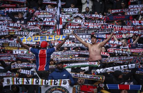 PSG's supporters during the French League One soccer match between Paris Saint-Germain and Reims at the Parc des Princes stadium in Paris, France, Sunday, March 10, 2024. (AP Photo/Aurelien Morissard)