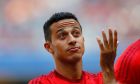 Bayern's Thiago from Spain gestures during a show training and team presentation for the upcoming German first division Bundesliga soccer season at the Allianz Arena in Munich, Germany, on Saturday, July 11, 2015. (AP Photo/Matthias Schrader)