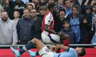 Manchester City's Rodri is injured next to Arsenal's Thomas Partey during the English Premier League soccer match between Manchester City and Arsenal at the Etihad stadium in Manchester, England, Sunday, Sept. 22, 2024. (AP Photo/Dave Thompson)