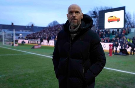 Manchester United's head coach Erik ten Hag looks at the field before the FA Cup fourth round soccer match between Newport County and Manchester United at the Rodney Parade stadium in Newport, Wales, Sunday, Jan. 28, 2024. (AP Photo/Alastair Grant)