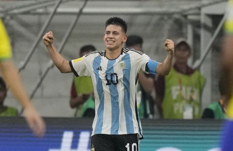 Argentina's Claudio Echeverri celebrates after scoring his team's opening goal during the FIFA U-17 World Cup quarterfinal soccer match between Brazil and Argentina at Jakarta international Stadium in Jakarta, Indonesia, Friday, Nov. 24, 2023. (AP Photo/Achmad Ibrahim)