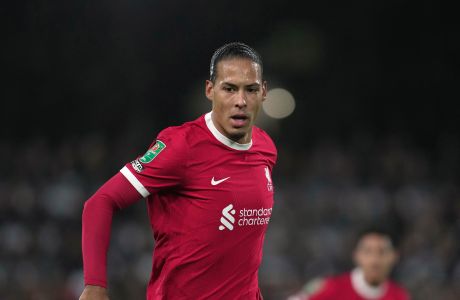 Liverpool's Virgil van Dijk gestures at the English League Cup semi final second leg soccer match between Fulham and Liverpool, at Craven Cottage stadium in London, England, Wednesday, Jan. 24, 2024. (AP Photo/Kin Cheung)