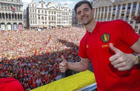 Belgian soccer team player Thibaut Courtois reacts on the balcony of the city hall at the Grand Place in Brussels, Sunday, July 15, 2018. Belgium placed third in the World Cup 2018. (Yves Herman, Pool Photo via AP)