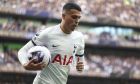 Tottenham's Sergio Reguilon carries the ball as he goes to take a corner kick during the English Premier League soccer match between Tottenham Hotspur and Nottingham Forrest t White Hart Lane stadium in London, Sunday, April 7, 2024. (AP Photo/Ian Walton)