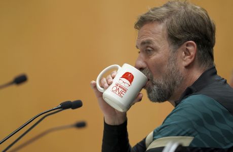 FILE - Liverpool's manager Jurgen Klopp drinks during a press conference ahead of the Champions League final at the training centre in Liverpool, England, Wednesday, May 25, 2022. Jurgen Klopp announced Friday Jan. 26, 2024, he will step down as Liverpool manager at end of this season. (AP Photo/Jon Super, File)