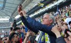 Portuguese soccer coach Jose Mourinho takes photographs with supporters during his official presentation as Turkish's Fenerbahce new coach at Sukru Saracoglu stadium in Istanbul, Turkey, Sunday, June 2, 2024. Mourinho has signed a two-year contract with Fenerbahce. (AP Photo)