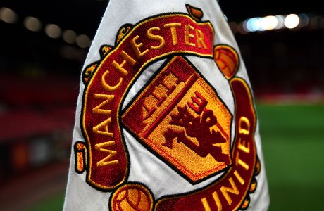 One of the corner flags on the pitch as final preparations are made for the upcoming English League Cup semifinal first leg soccer match between Manchester United and Manchester City and at Old Trafford, Manchester, England,Tuesday, Jan. 7, 2020. (AP Photo/Jon Super)