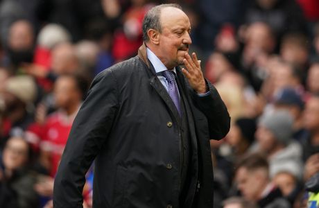 File - Everton's head coach Rafael Benitez leaves the pitch at half-time, during the English Premier League soccer match between Manchester United and Everton, at Old Trafford, Manchester, England, Saturday, Oct. 2, 2021. Rafa Benitez has been fired as Everton manager following a 2-1 loss to Norwich in the Premier League that plunged the team closer to the relegation zone. Benitez was a contentious appointment in the offseason owing to his close links with Evertons local rival, Liverpool, for whom he was manager from 2004-10 and led to a Champions League title in 2005.  (Dave Thompson, Pool via AP, File)