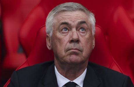 Real Madrid's head coach Carlo Ancelotti sits on the bench during the Champions League final soccer match between Borussia Dortmund and Real Madrid at Wembley stadium in London, Saturday, June 1, 2024. (AP Photo/Ian Walton)