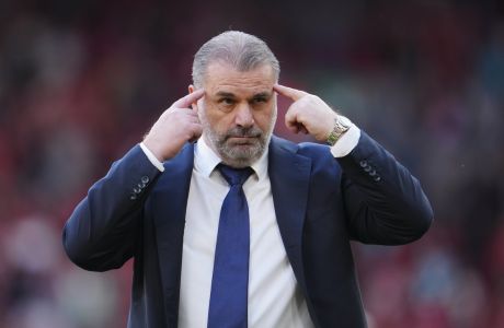 Tottenham's head coach Ange Postecoglou gestures as he leaves the pitch at the end of the English Premier League soccer match between Liverpool and Tottenham Hotspur at Anfield Stadium in Liverpool, England, Sunday, May 5, 2024. (AP Photo/Jon Super)