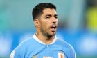 Uruguay's Luis Suarez sings the national anthem before the World Cup group H soccer match between Ghana and Uruguay, at the Al Janoub Stadium in Al Wakrah, Qatar, Friday, Dec. 2, 2022. (AP Photo/Manu Fernandez)