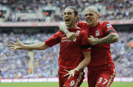 Liverpool's Andy Carroll, left, celebrates his goal against Everton with teammate Martin Skrtel during their English FA Cup semifinal soccer match at Wembley Stadium in London, Saturday, April 14, 2012. (AP Photo/Tom Hevezi)