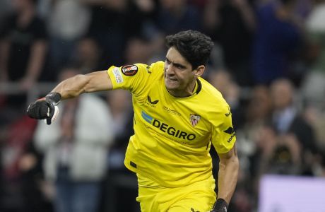 Sevilla's goalkeeper Bono celebrates after he save a penalty during penalty shootouts during the Europa League final soccer match between Roma and Sevilla at the Puskas Arena stadium in Budapest, Hungary, Wednesday, May 31, 2023. (AP Photo/Darko Bandic)