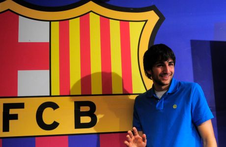 Spanish basketball player Ricky Rubio gestures after a press conference at the Nou Camp stadium in Barcelona, Spain, Friday, June 17, 2011. Ricky Rubio is joining the Minnesota Timberwolves. The 20-year-old Spanish guard ended two years of speculation on Friday when he said, "I have finally decided to start the journey" to the NBA. (AP Photo/Manu Fernandez)