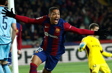 Barcelona's Vitor Roque celebrates after scoring against Osasuna during a Spanish La Liga soccer match between Barcelona and Osasuna at the Olimpic Lluis Companys stadium in Barcelona, Spain, Wednesday, Jan. 31, 2024. (AP Photo/Joan Monfort)