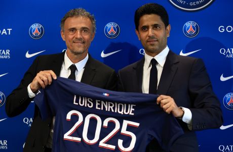 Newly named PSG coach Luis Enrique, left, holds a team jersey with PSG president Nasser Al-Khelaifi during a press conference at the new Paris-Saint-Germain training ground Wednesday, July 5, 2023 in Poissy, west of Paris. Paris Saint-Germain fired coach Christophe Galtier after a disappointing season on and replaced him with former Spain and Barcelona manager Luis Enrique. (AP Photo/Aurelien Morissard)