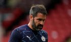 Manchester City goalkeeper Scott Carson walks off the pitch after suffering an injury in the warm up before the English Premier League soccer match between Sheffield United and Manchester City at Bramall Lane stadium in Sheffield, England, Saturday, Oct. 31, 2020. (Tim Keeton/Pool via AP)