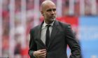 Manchester City's head coach Pep Guardiola gestures prior to the English FA Cup final soccer match between Manchester City and Manchester United at Wembley Stadium in London, Saturday, May 25, 2024. (AP Photo/Kin Cheung)