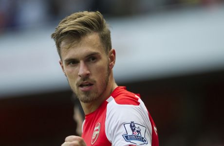 Arsenal's Aaron Ramsey celebrates after scoring against Crystal Palace, during their English Premier League soccer match, at Emirates Stadium, in London, Saturday, Aug. 16, 2014. (AP Photo/Bogdan Maran)