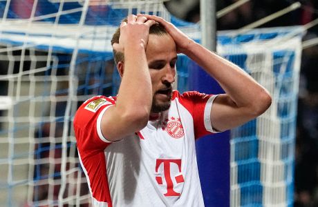 Bayern's Harry Kane reacts disappointed after missing a chance during the German Bundesliga soccer match between VfL Bochum and FC Bayern Munich in Bochum, Germany, Sunday, Feb. 18, 2024. (AP Photo/Martin Meissner)