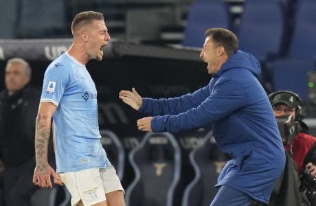 Lazio's Sergej Milinkovic-Savic, left, celebrates after scoring his side's opening goal during the Italian Serie A soccer match between Lazio and Juventus at the Stadio Olimpico stadium in Rome, Italy, Saturday, April 8, 2023. (AP Photo/Alessandra Tarantino)