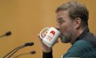 FILE - Liverpool's manager Jurgen Klopp drinks during a press conference ahead of the Champions League final at the training centre in Liverpool, England, Wednesday, May 25, 2022. Jurgen Klopp announced Friday Jan. 26, 2024, he will step down as Liverpool manager at end of this season. (AP Photo/Jon Super, File)