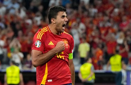 Spain's Rodri celebrates at the end of the semifinal match between Spain and France at the Euro 2024 soccer tournament in Munich, Germany, Tuesday, July 9, 2024. (AP Photo/Hassan Ammar)