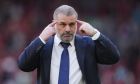 Tottenham's head coach Ange Postecoglou gestures as he leaves the pitch at the end of the English Premier League soccer match between Liverpool and Tottenham Hotspur at Anfield Stadium in Liverpool, England, Sunday, May 5, 2024. (AP Photo/Jon Super)