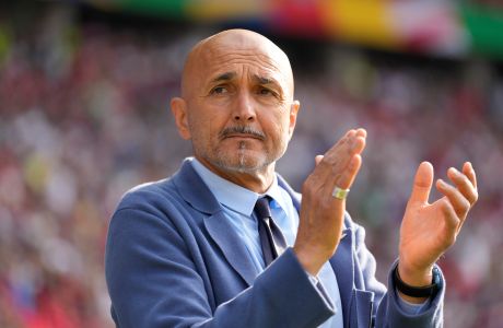 Italy's head coach Luciano Spalletti applauds before a round of sixteen match between Switzerland and Italy at the Euro 2024 soccer tournament in Berlin, Germany, Saturday, June 29, 2024. (AP Photo/Ariel Schalit)