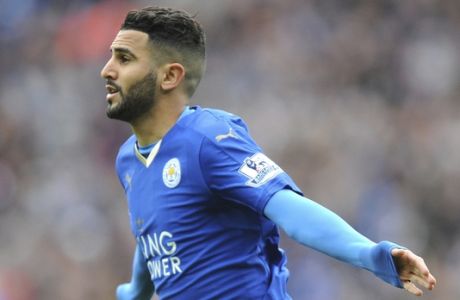 FILE- In this Sunday, April 24, 2016 file photo, Leicester's Riyad Mahrez celebrates after scoring during the English Premier League soccer match between Leicester City and Swansea City at the King Power Stadium in Leicester, England.  Riyad Mahrez will miss a second straight Premier League game for Leicester, with coach Claude Puel saying Friday feb. 2, 2018 that the winger needs to clear his head after being subject of a bid from Manchester City at the end of the January transfer window. Mahrez has reportedly failed to turn up for Leicesters last three training sessions, and also didnt travel for the 2-1 loss at Everton on Wednesday. (AP Photo/Rui Vieira, File)