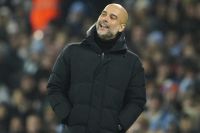 Manchester City's head coach Pep Guardiola reacts during the English League Cup soccer match between Manchester City and Liverpool at Etihad stadium in Manchester, England, Thursday, Dec. 22, 2022. (AP Photo/Jon Super)