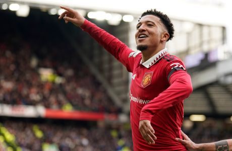 Manchester United's Jadon Sancho celebrates after scoring his side's third goal during the English Premier League soccer match between Manchester United and Leicester City at the Stamford Bridge stadium in Manchester, England, Sunday, Feb. 19, 2023. (AP Photo/Dave Thompson)