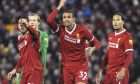 Liverpool's Emre Can, Loris Karius, Joel Matip, Virgil van Dijk, from left to right, react during the English Premier League soccer match between Liverpool and Tottenham Hotspur at Anfield, Liverpool, England, Sunday, Feb. 4, 2018. (AP Photo/Rui Vieira)