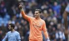 Manchester City's goalkeeper Ederson celebrates at the end of the English Premier League soccer match between Manchester City and and Newcastle, at the Etihad stadium in Manchester, England, Saturday, March 4, 2023. (AP Photo/Dave Thompson)