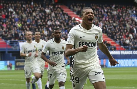 Monaco's Kylian Mbappe celebrates after scoring his first goal during their French League One soccer match against Caen, in Caen, north western France, Sunday, March 19, 2017. Mbappe scored two goals as Monaco won 3-0. (AP Photo/David Vincent)