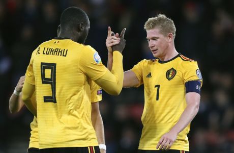 Belgium's Kevin De Bruyne, right, celebrates with with Belgium's Romelu Lukaku after scoring his sides fourth goal during the Euro 2020 group I qualifying soccer match between Scotland and Belgium at Hampden Park stadium in Glasgow, Monday, Sept. 9, 2019. (AP Photo/Scott Heppell)