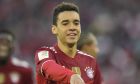 Bayern's Jamal Musiala celebrates after scoring his side's third goal during the German Bundesliga soccer match between Bayern Munich and Hertha Berlin at the Allianz Arena stadium in Munich, Germany, Saturday, Aug. 28, 2021. (AP Photo/Matthias Schrader)