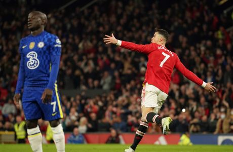 Manchester United's Cristiano Ronaldo celebrates after scoring his side's first goal during the English Premier League soccer match between Manchester United and Chelsea, at Old Trafford Stadium, Manchester, England, Thursday, April, 2022. (AP Photo/Dave Thompson)