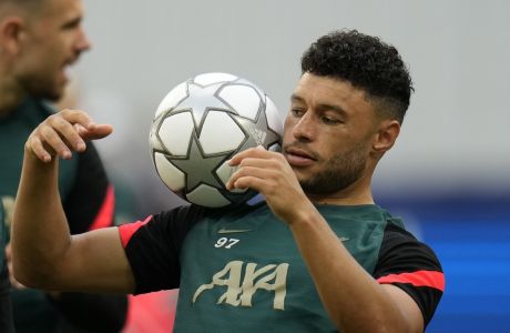 Liverpool's Alex Oxlade-Chamberlain controls the ball during a training session at the Stade de France in Saint Denis near Paris, Friday, May 27, 2022. Liverpool and Real Madrid are making their final preparations before facing each other in the Champions League final soccer match on Saturday. (AP Photo/Manu Fernandez)