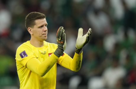 Poland's goalkeeper Wojciech Szczesny applauds fans at the end of the World Cup group C soccer match between Poland and Saudi Arabia, at the Education City Stadium in Al Rayyan , Qatar, Saturday, Nov. 26, 2022. (AP Photo/Francisco Seco)