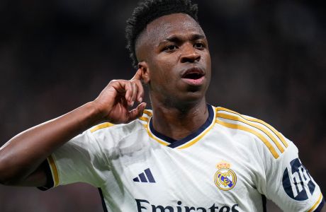 Real Madrid's Vinicius Junior celebrates after scoring his side's opening goal during the Champions League round of 16 second leg soccer match between Real Madrid and RB Leipzig at the Santiago Bernabeu stadium in Madrid, Spain, Wednesday, March 6, 2024. (AP Photo/Manu Fernandez)