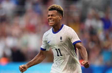 France's Desire Doue celebrates after scoring his side's second goal during the men's Group A soccer match between New Zealand and France at the Velodrome Stadium, during the 2024 Summer Olympics, Tuesday, July 30, 2024, in Marseille, France. (AP Photo/Daniel Cole)