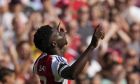 Arsenal's Bukayo Saka celebrates after scoring his side's second goal during the English Premier League soccer match between Arsenal and Wolverhampton Wanderers at Emirates Stadium in London, England, Saturday, Aug. 17, 2024. (AP Photo/Frank Augstein)