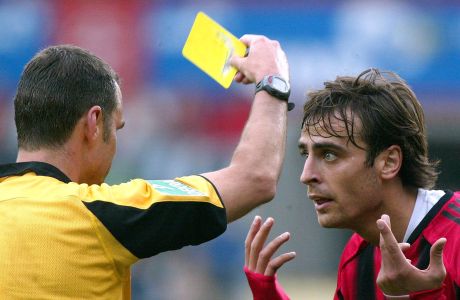 Leverkusen's Dimitar Berbatov, right, reacts while referee Joerg Kessler shows the yellow card to him during the German first division soccer match between Bayer Leverkusen and Hamburg's SV at the BayArena in Leverkusen, western Germany, Saturday, Oct. 2, 2004. Leverkusen won the match 3-0. (AP Photo/Hermann J. Knippertz)