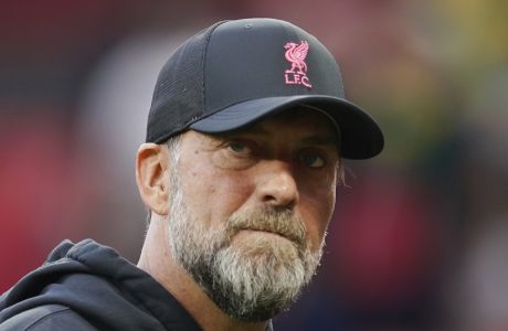 Liverpool's manager Jurgen Klopp walks prior to the start of the English Premier League soccer match between Manchester United and Liverpool at Old Trafford stadium, in Manchester, England, Monday, Aug 22, 2022. (AP Photo/Dave Thompson)