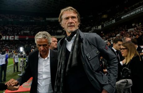 FILE - Sir Jim Ratcliffe looks on ahead of the French League One soccer match between Nice and Paris Saint Germain in Allianz Riviera stadium in Nice, southern France, on Oct.18, 2019. More than a year after it was put up for sale, Manchester United said Sunday that British billionaire Jim Ratcliffe had agreed to buy a minority stake in the storied Premier League club. Ratcliffe, who owns petrochemicals giant INEOS and is one of Britains richest people, has bought a stake of up to 25% of the 20-time league champions and will invest $300 million in its Old Trafford stadium. (AP Photo/Daniel Cole, File)
