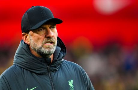 Liverpool's manager Jurgen Klopp looks his players during the warm up prior to the start of the English FA Cup fourth round soccer match between Liverpool and Norwich, at Anfield stadium in Liverpool, England, Sunday, Jan. 28, 2024. (AP Photo/Jon Super)