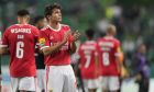 Benfica's Joao Neves waves supporters at the end of the Portuguese League soccer match between Sporting CP and Benfica at the Alvalade stadium in Lisbon, Sunday, May 21, 2023. (AP Photo/Armando Franca)